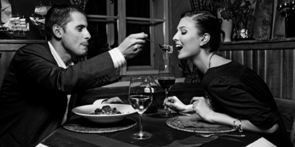 man feeding pasta man feeding pasta