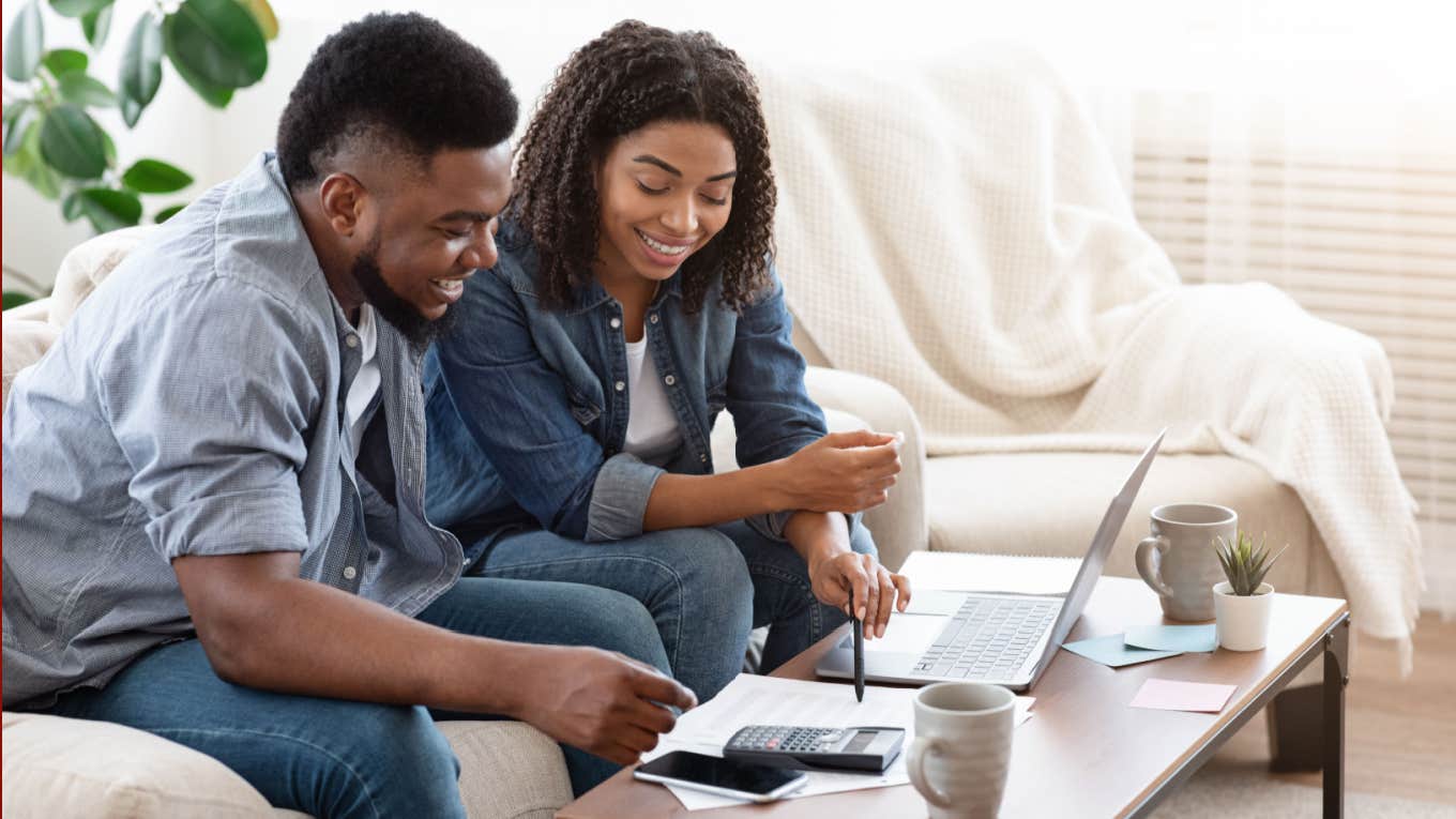 Woman Reveals The 3 Things She Did To Pay Off $65K In Debt — 'Break The Cycle Of Living Paycheck To Paycheck' couple budgeting expenses together