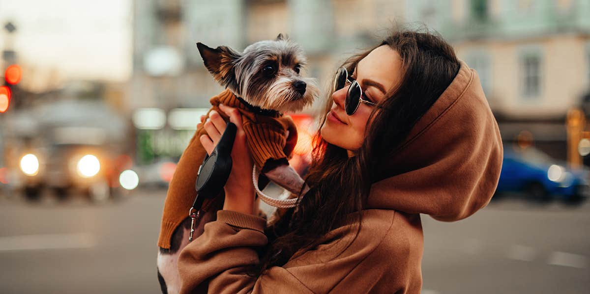 woman holding her dog