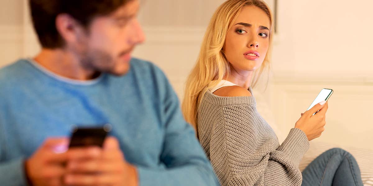 People With This Personality Type More Likely To Cheat, According To Research woman glancing over at guy worried