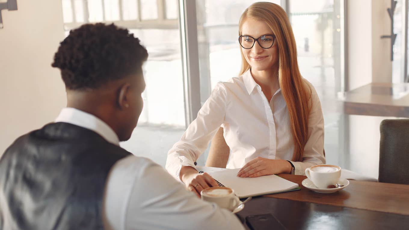 Manager smiling at a job interview. 