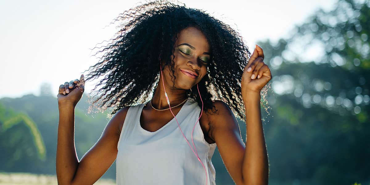 woman dancing listening to music