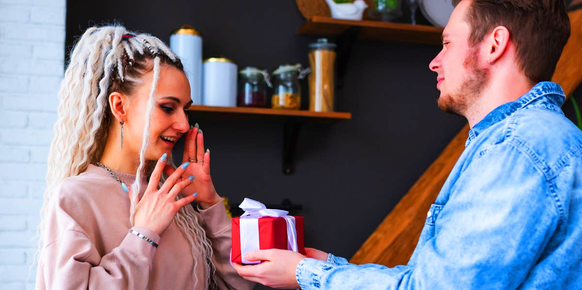 man giving girlfriend a present