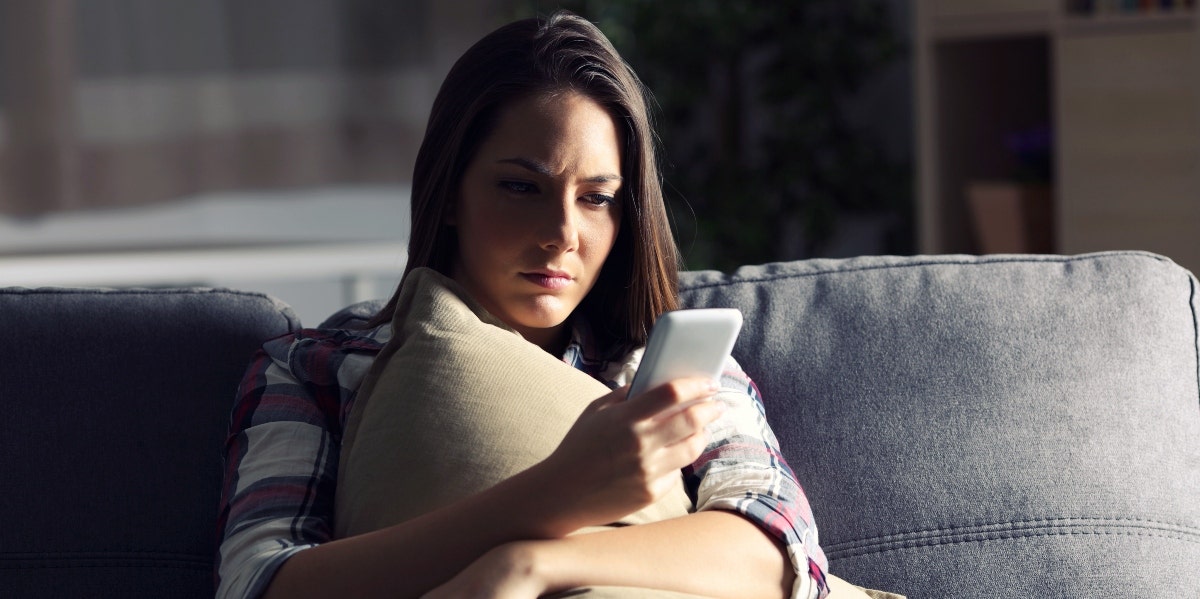 woman looking at her smartphone