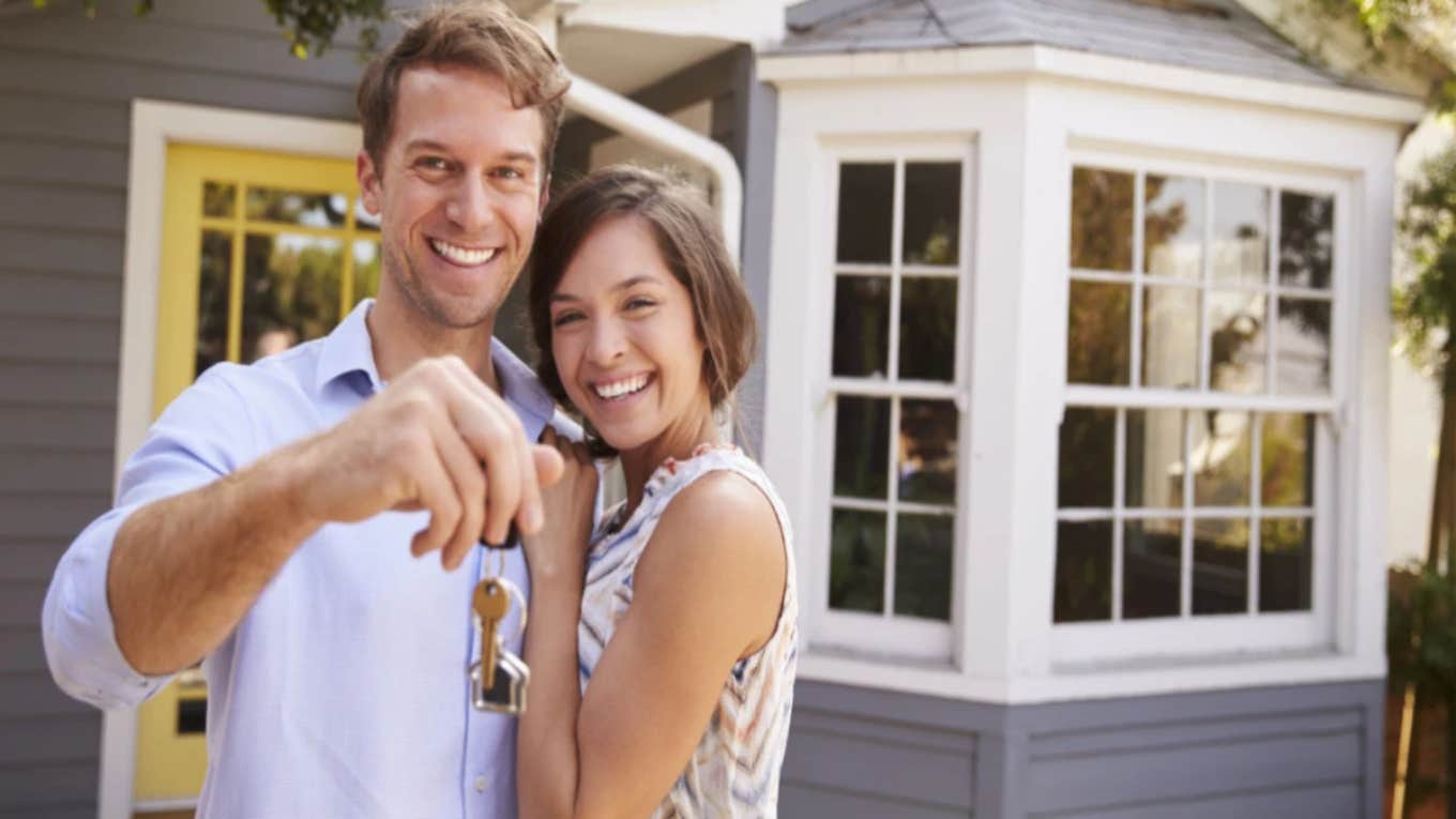 couple with keys to the home