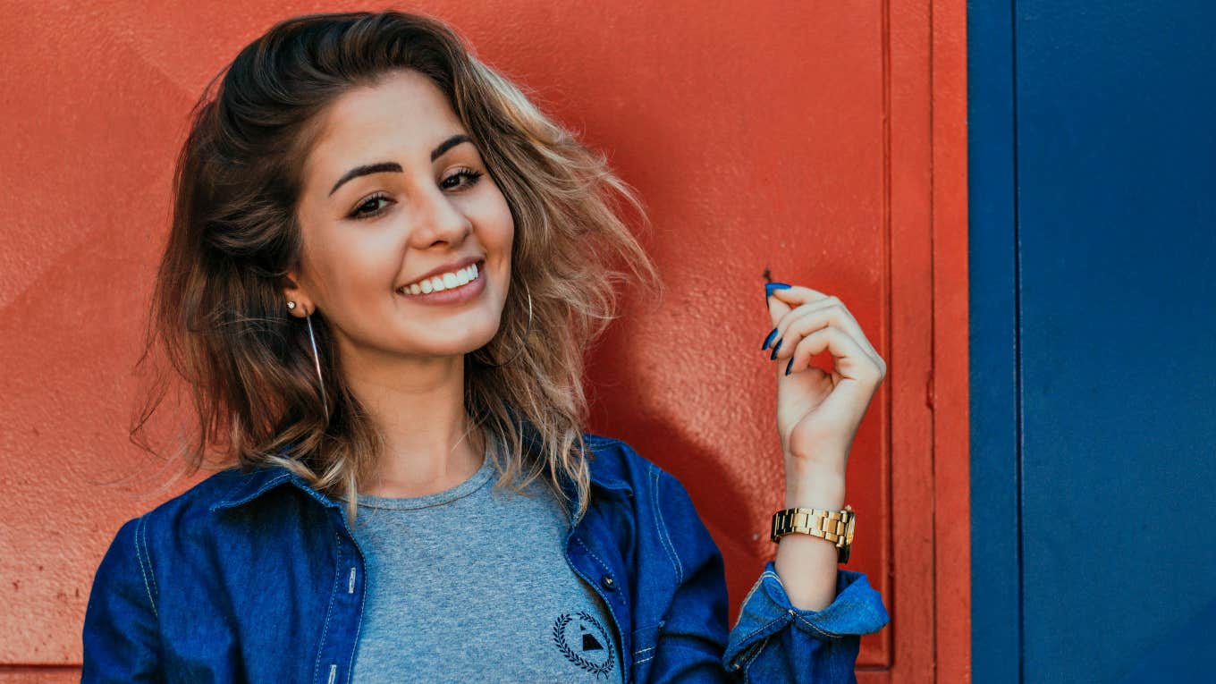 13 Personality Traits Of The Most Successful People smiling woman in blue