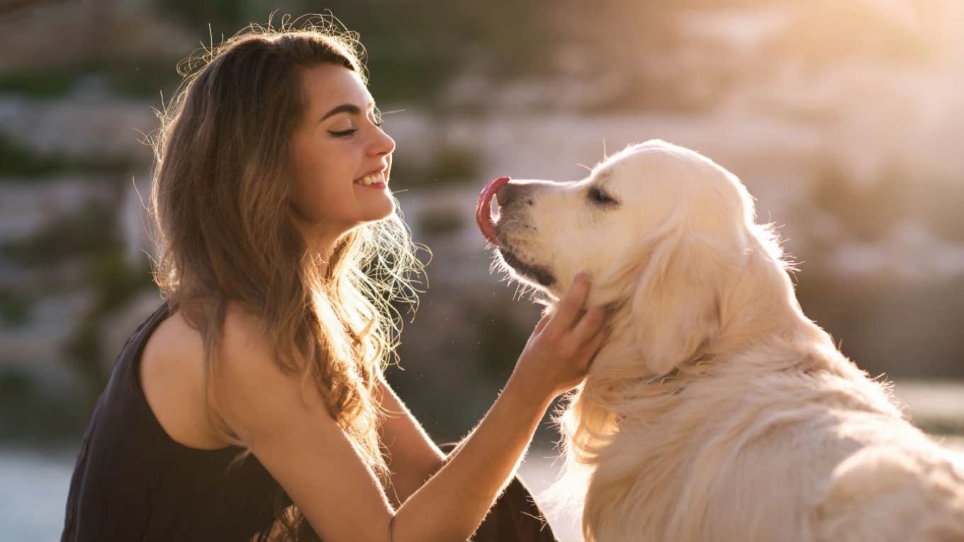 girl petting her dog