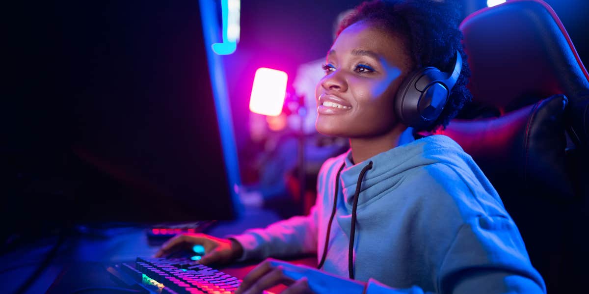 female gamer sitting at a computer