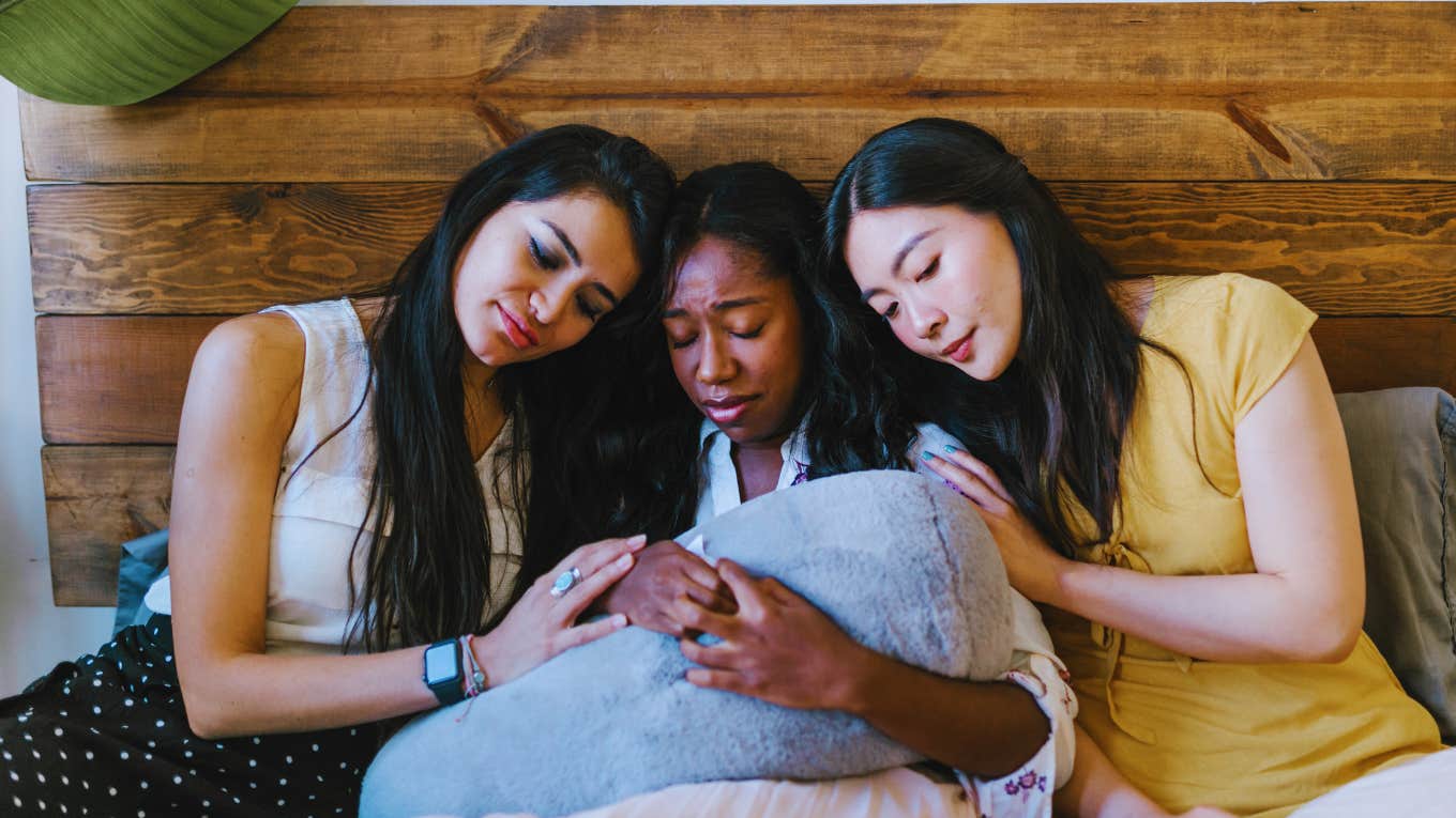 The Common Phrase We Use When Someone Dies, But Doesn't Actually Help At All friends comforting each other