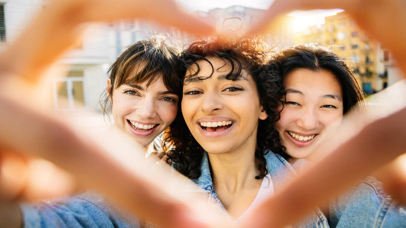 What Gen Z Wants To See On TV — And It's Not Romance Or Sex Gen Z faces inside heart hands
