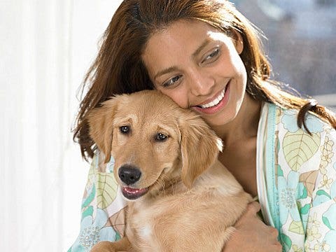 woman and puppy