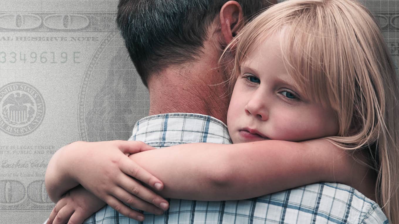 sad young giirl being held by grandpa