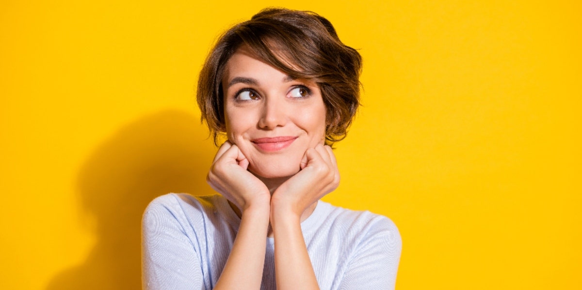 smiling woman on a yellow background