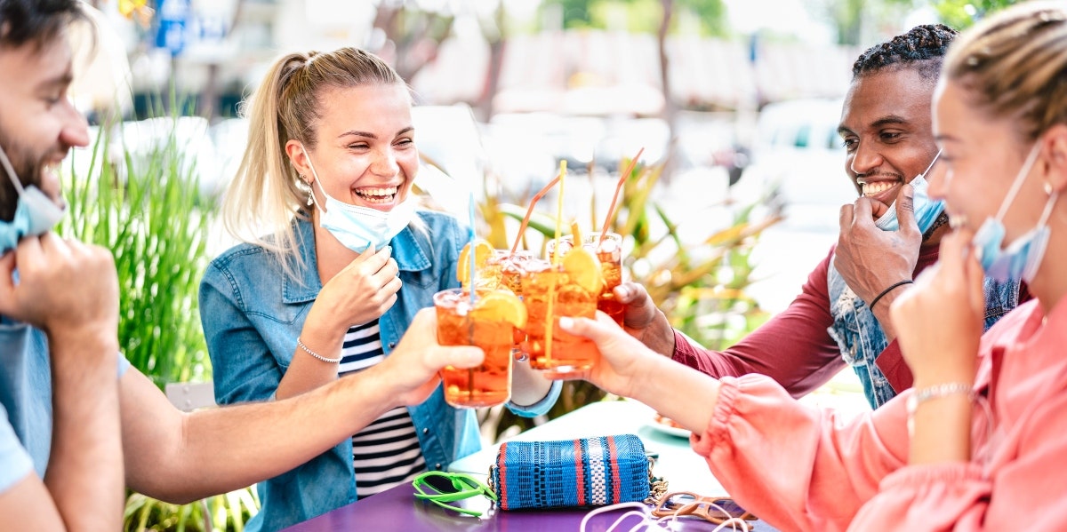 friends toasting drinks outside