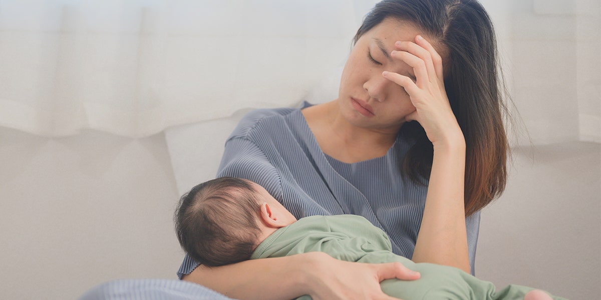 overwhelmed woman with baby