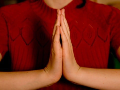pray prayer hands red sweater