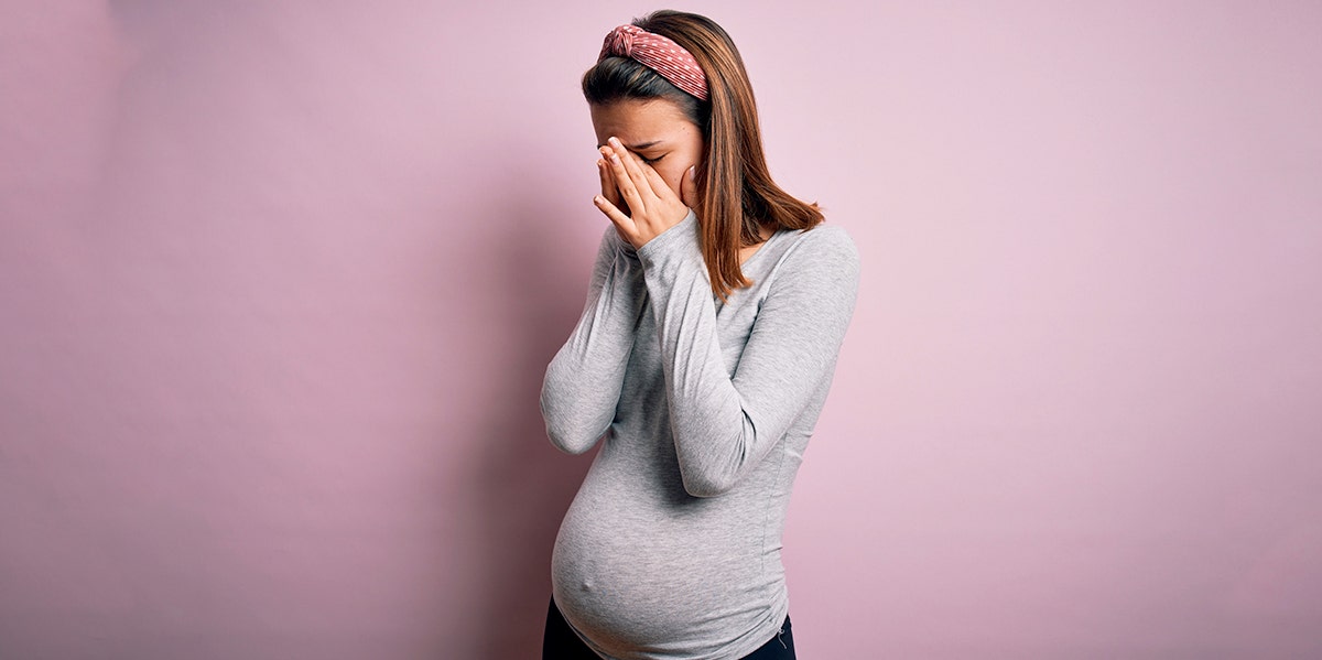 I Got Pregnant In College So I Wouldn't Have To Face Real Life pregnant woman with face in hands