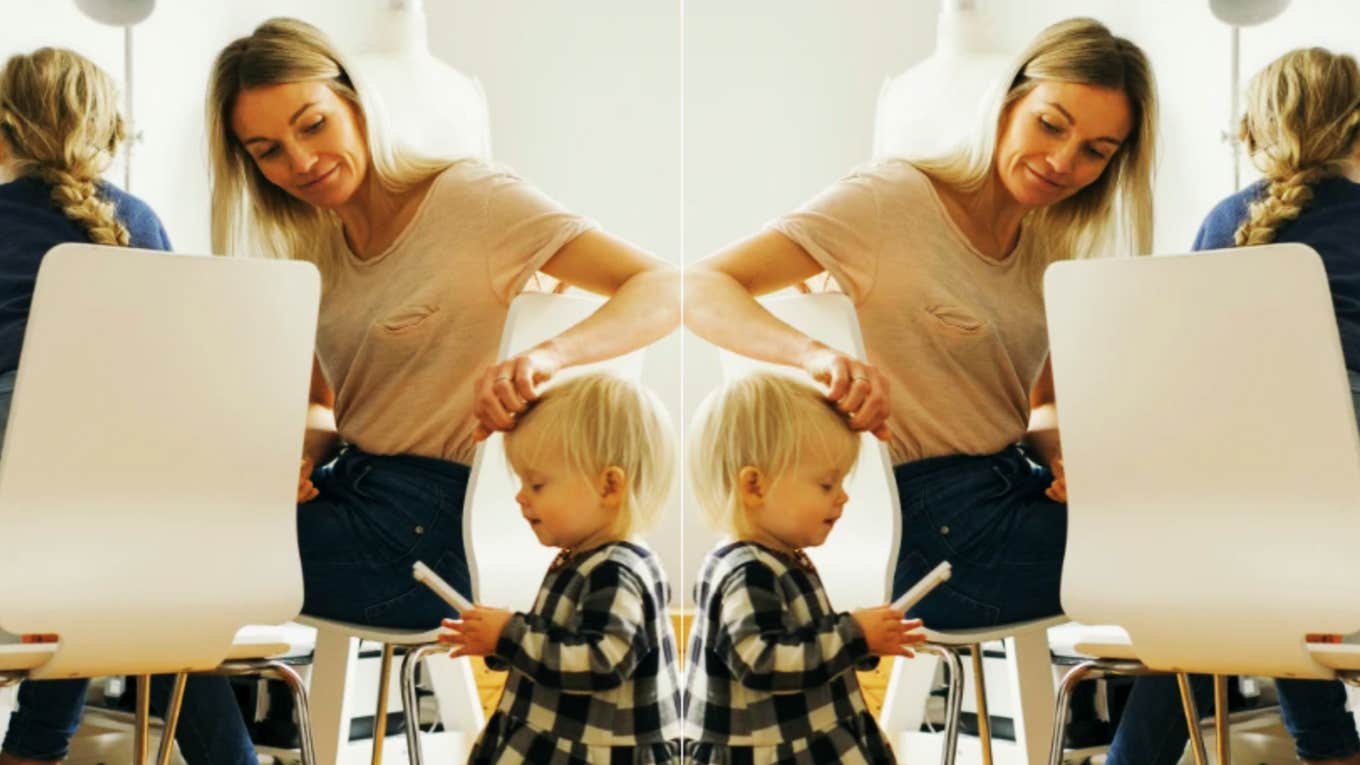 woman taking care of two children while working 