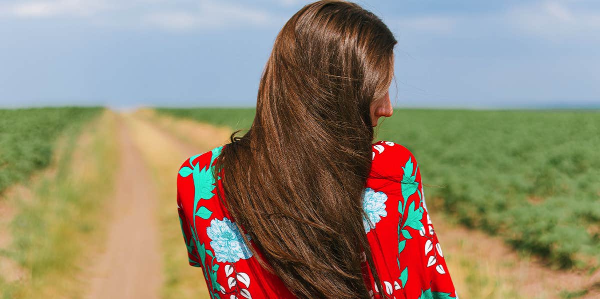 girl walking down country road