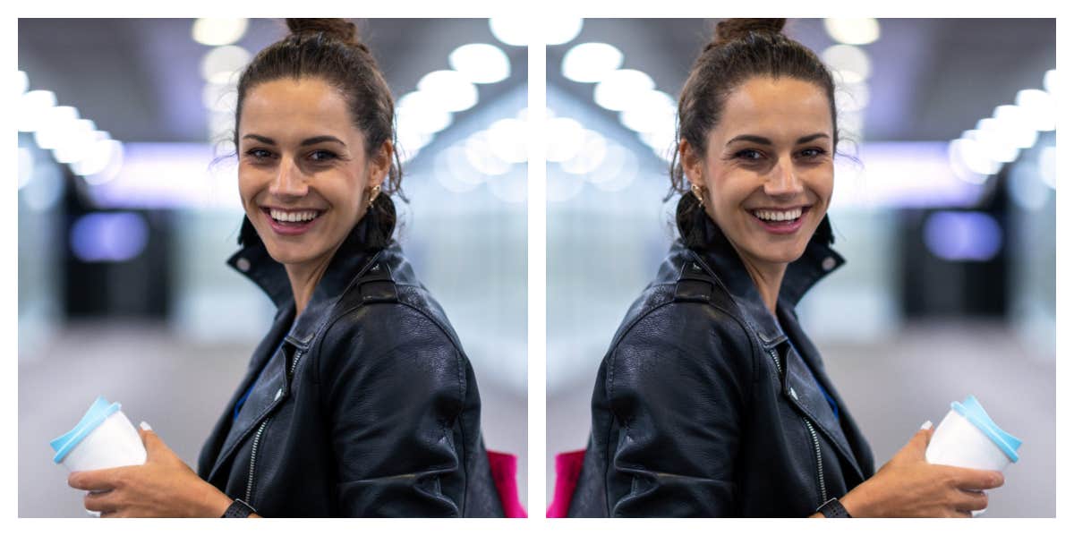 woman standing in a bright hallway, smiling