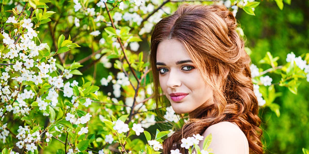 Professional psychic Mysterious redhead woman in nature