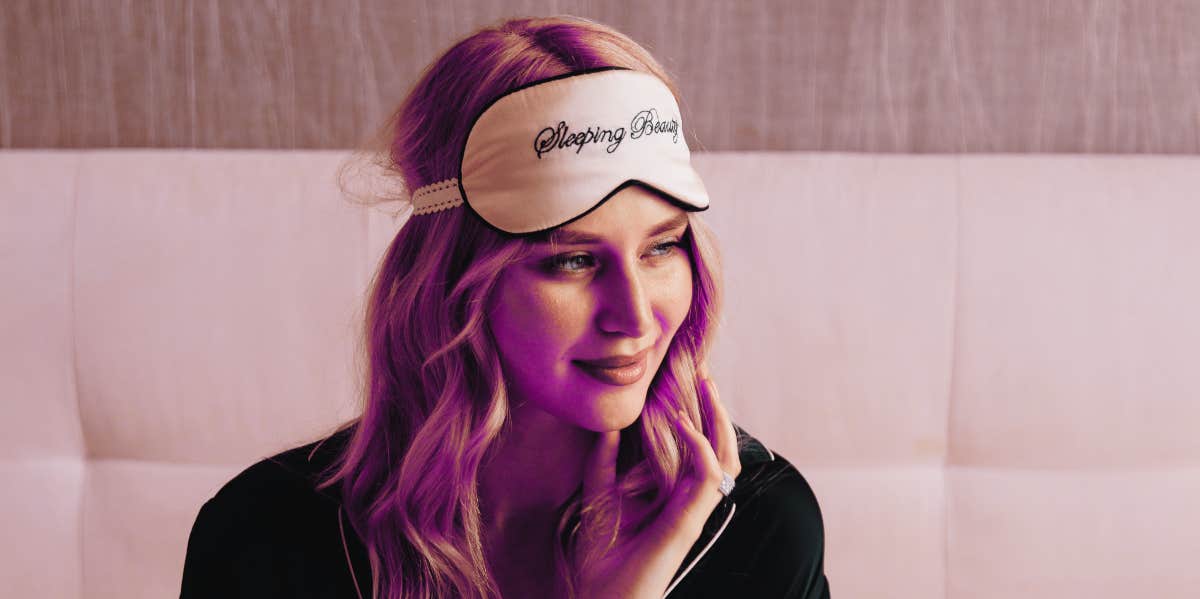 How To Subconsciously Reprogram Your Mind 5 Minutes Before Sleep, According To Wayne Dyer woman with sleep eye mask in bed