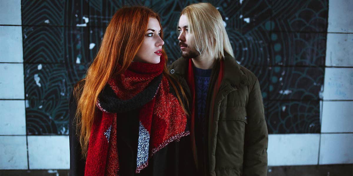 woman and man standing together wearing coats