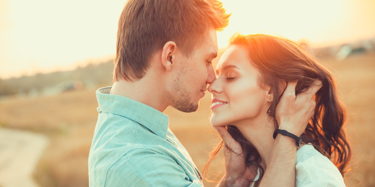 man and woman kissing