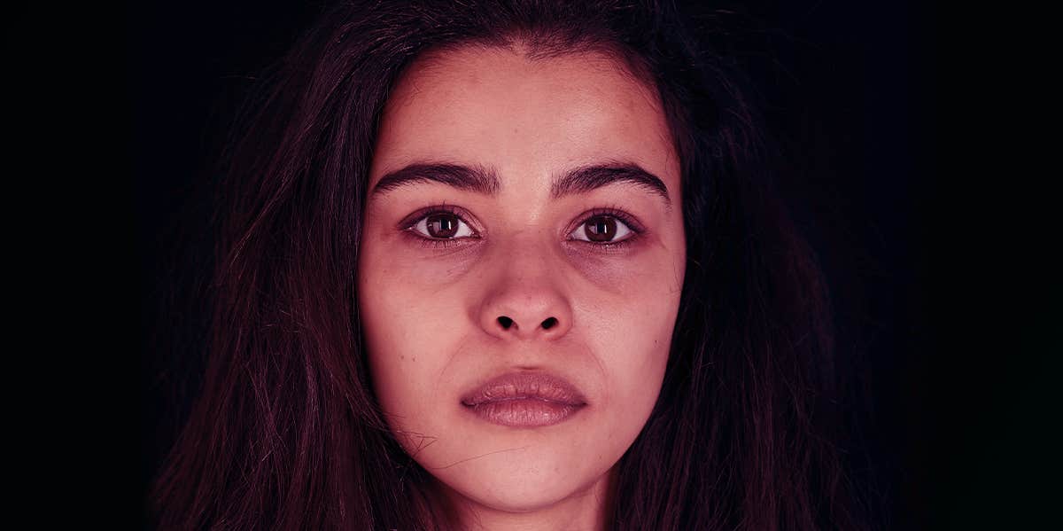 woman's face in dark room