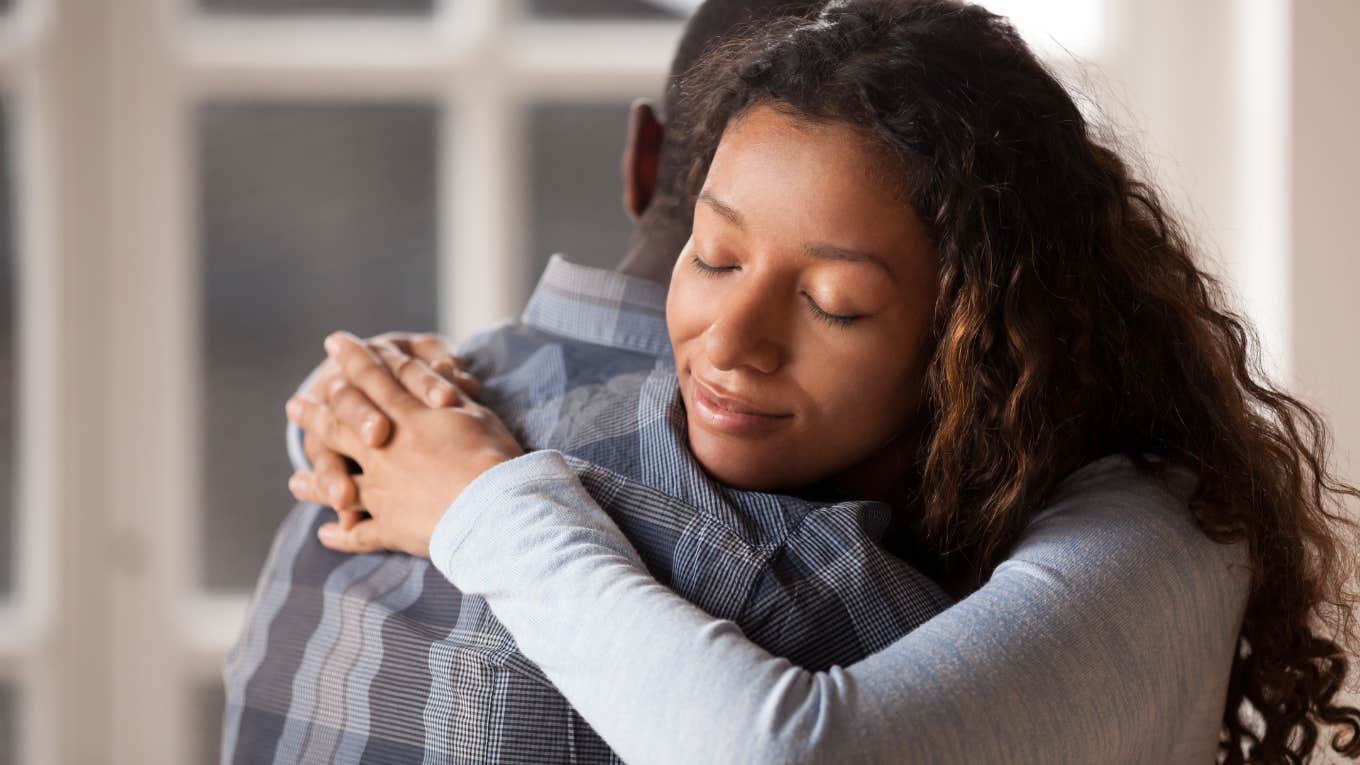 woman hugging husband