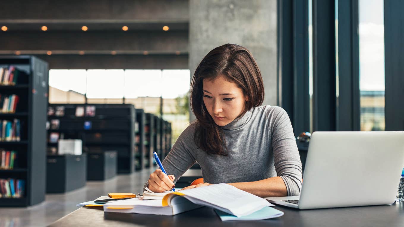 college student studying in library