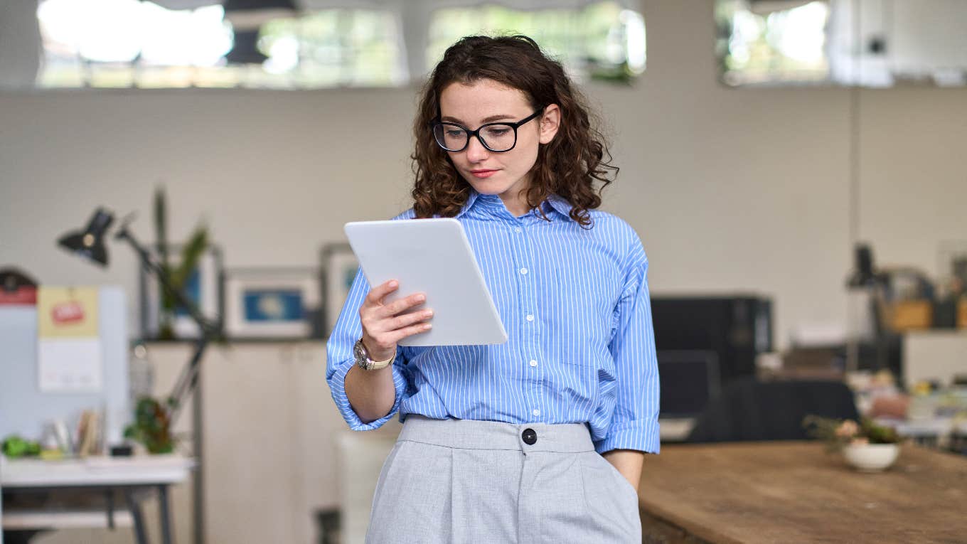 woman looking at tablet