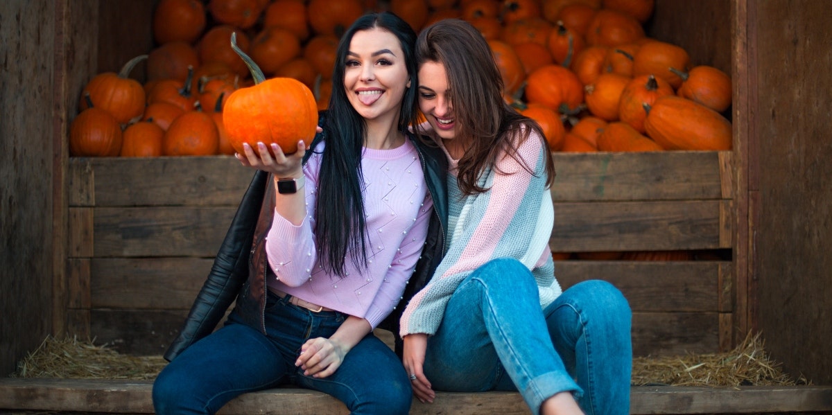 girls at a pumpkin patch