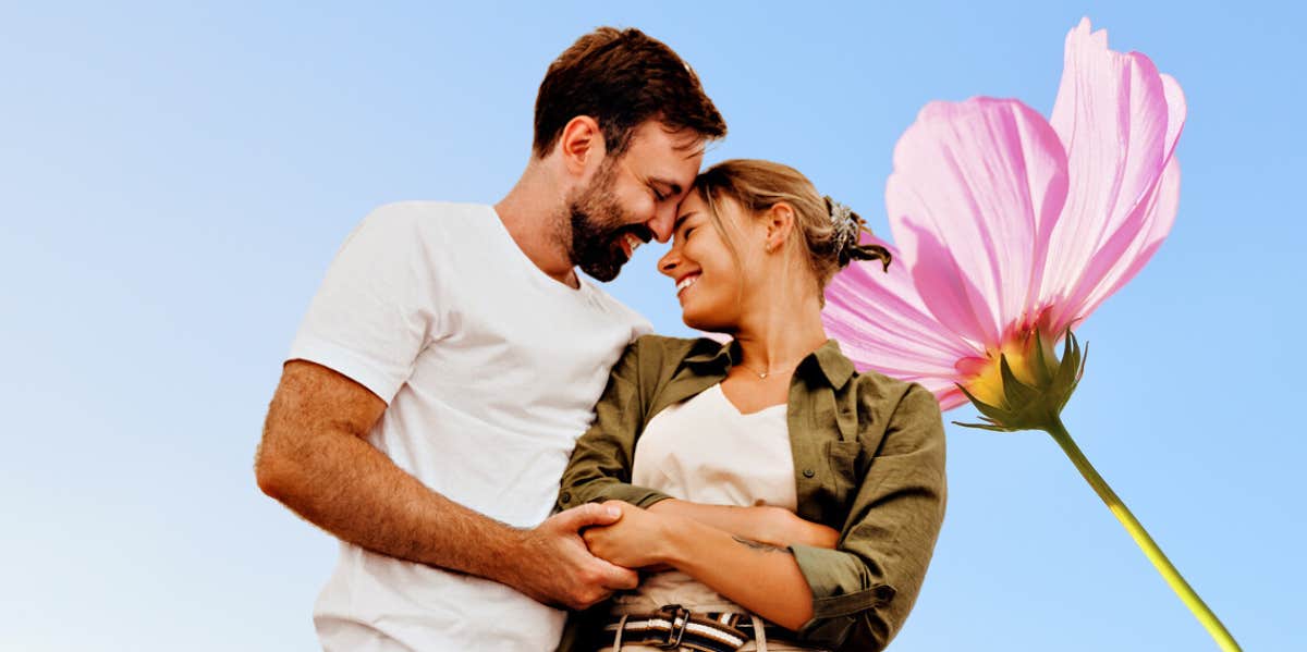 Most important question to ask before getting engaged couple embracing against a blue background with a big pink flower