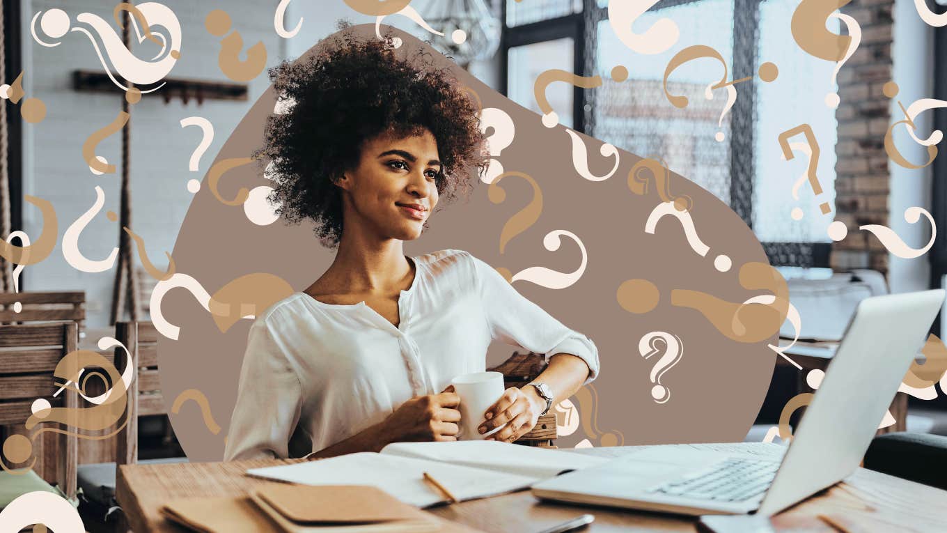 Woman sitting at desk contemplating 