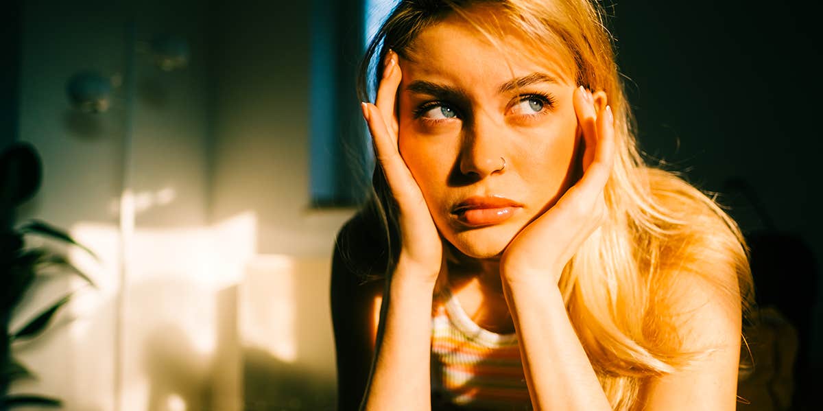 If You Answer These 13 Questions, Scientists Can Predict When You'll Die worried woman holding head