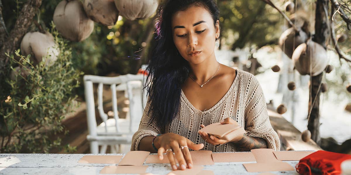 woman reading tarot cards