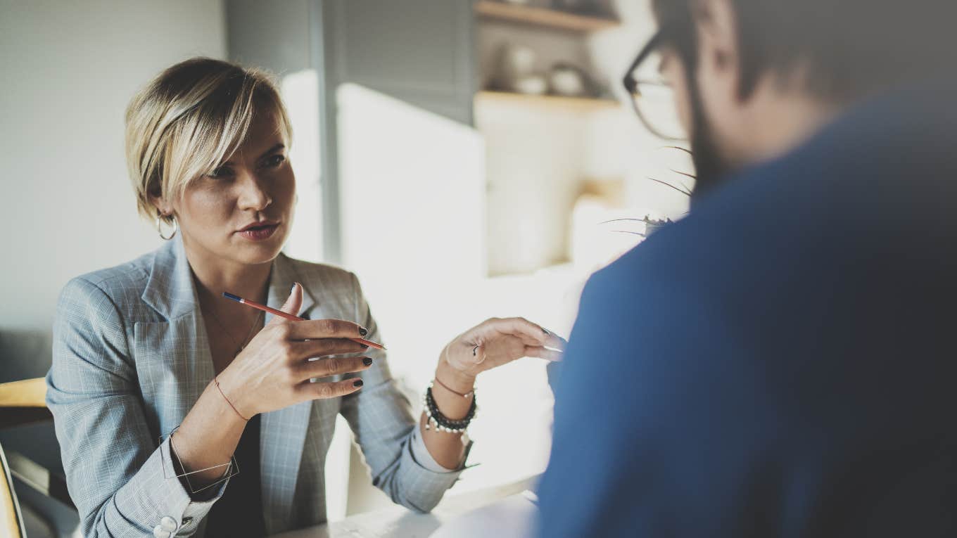 4 Uncomfortable Signs You’re Being Quiet Fired At Work people in meeting at the office