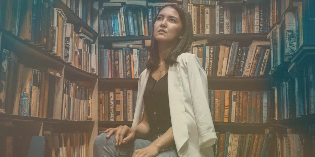 intelligent woman sitting in library