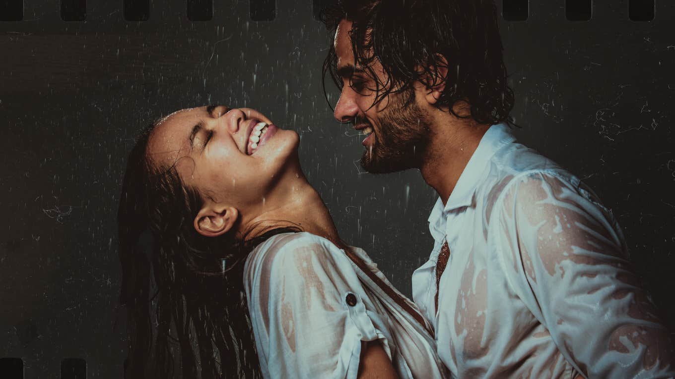 Couple laughing in the rain together