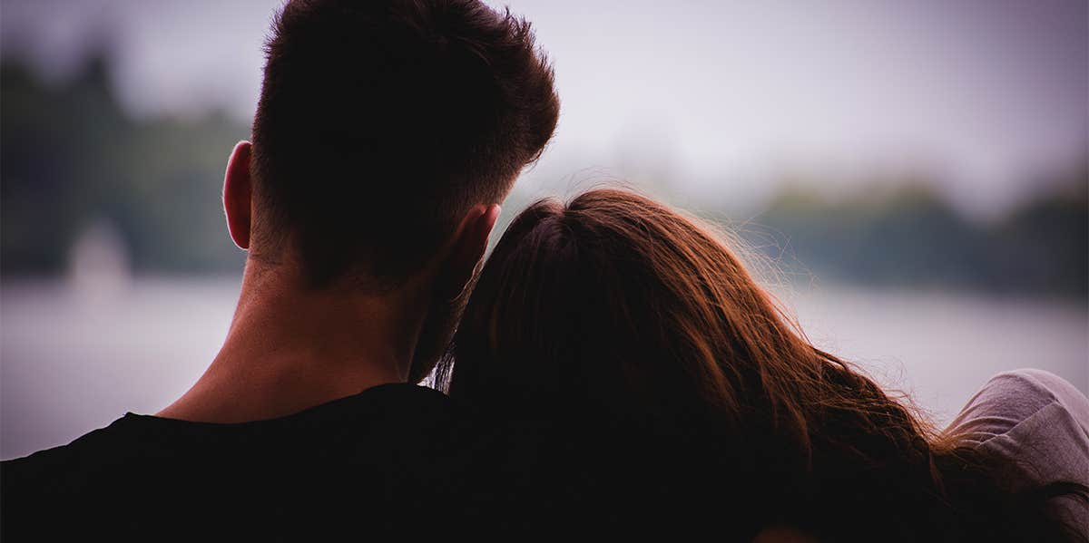 The Real (Sad) Reason Women Can't Change The Men They Love woman leaning on man