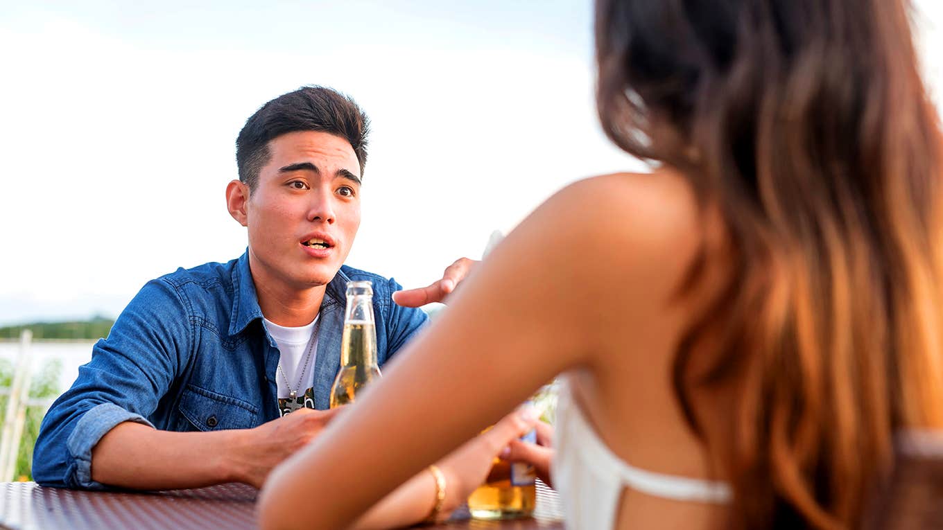 man talking to woman on dinner date