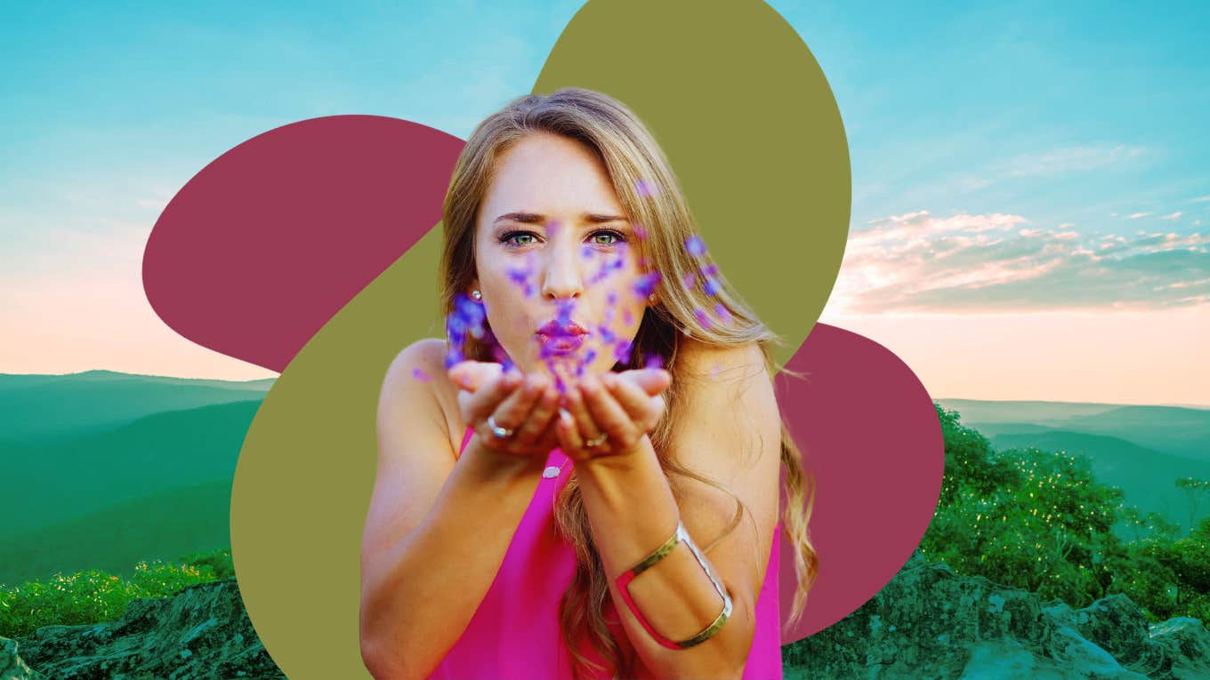 woman blowing flowers