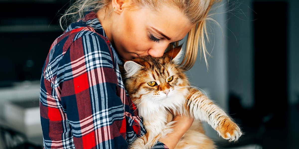 Girl loving her cat