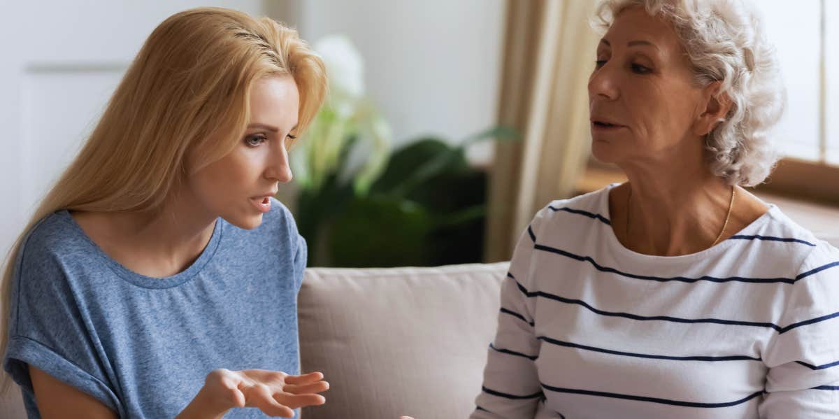 6 Experts Reveal The Most Common Reasons Parents And Their Adult Children Don't Get Along adult woman and her mother disagreeing