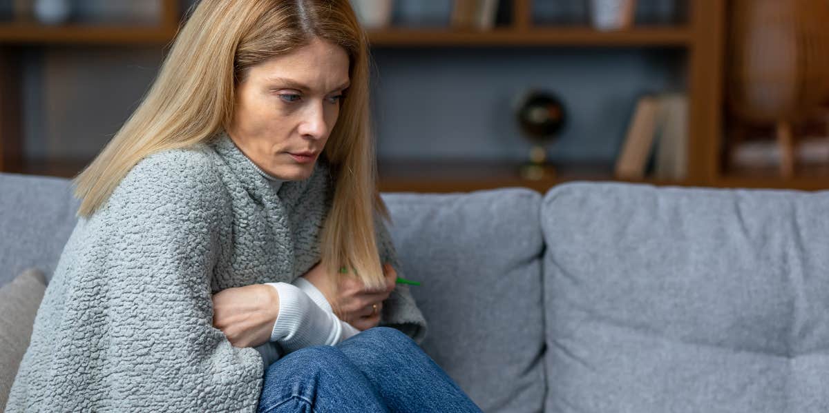 Woman on couch with blanket