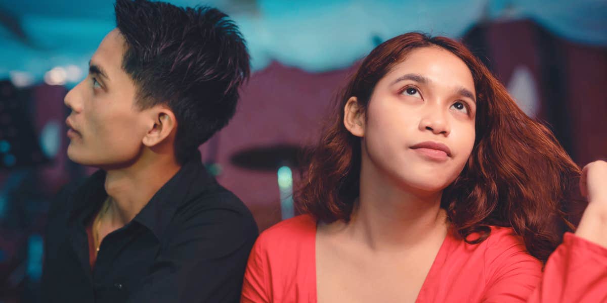 Simple ways to recharge a sluggish relationship Young couple looking bored and annoyed with one another