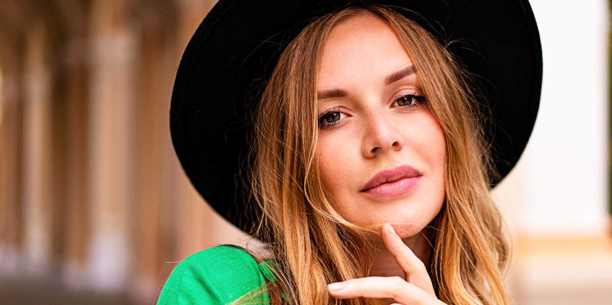 Confident woman in hat