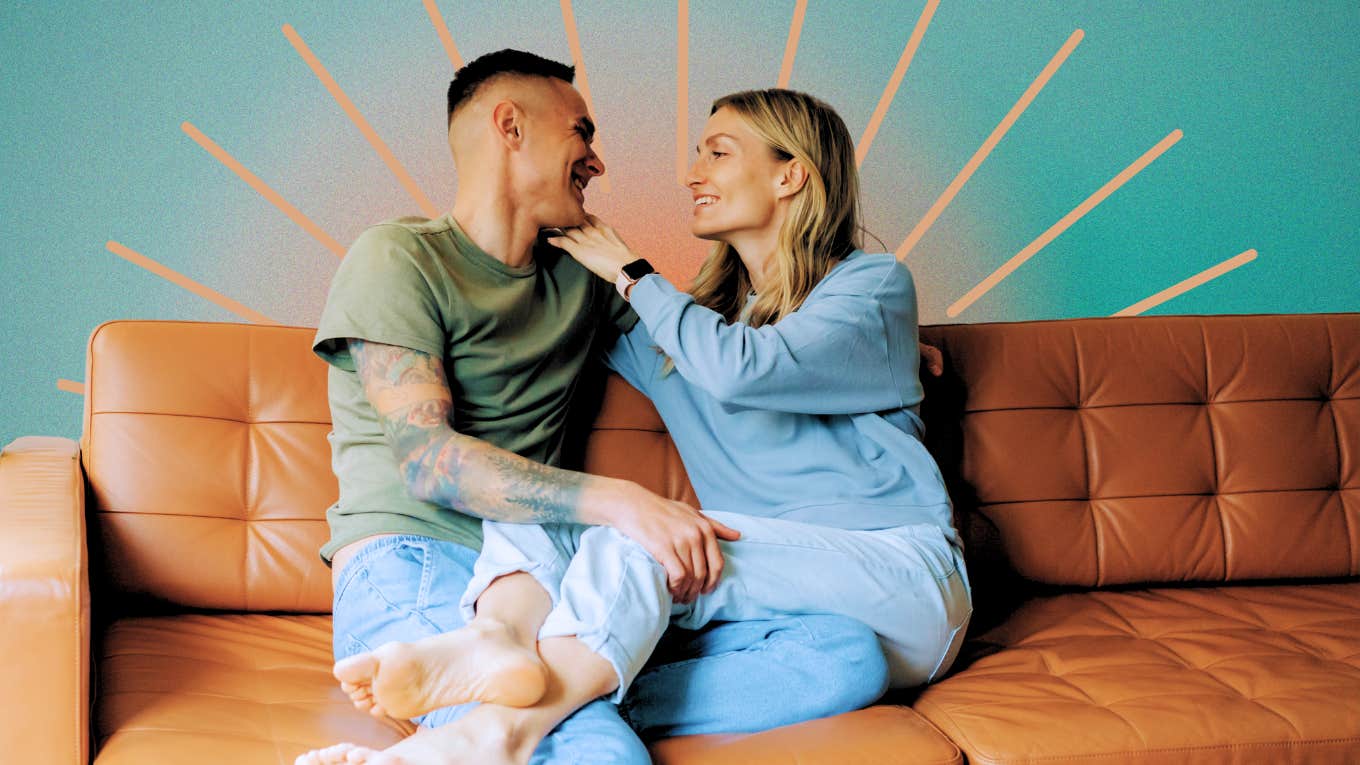 Couple, sitting closely smiling, reconnecting on couch