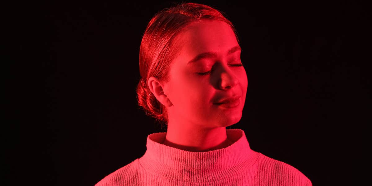 Red Aura Meaning & Personality Traits woman with red silhouette